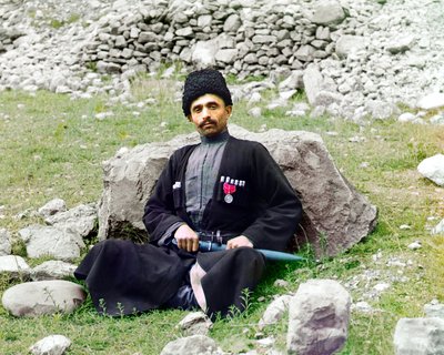 Dagestani types - Sunni Muslim man wearing traditional dress and headgear, with a sheathed dagger at his side by Sergey Prokudin Gorsky